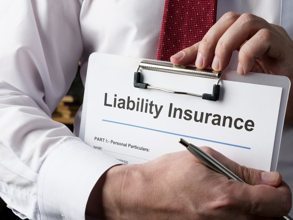 man holding liability insurance