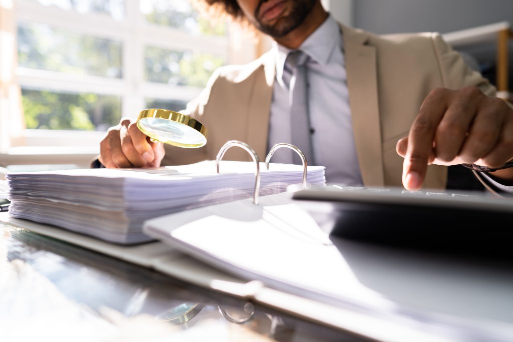 Lawyer-examining-workers-comp-documentation